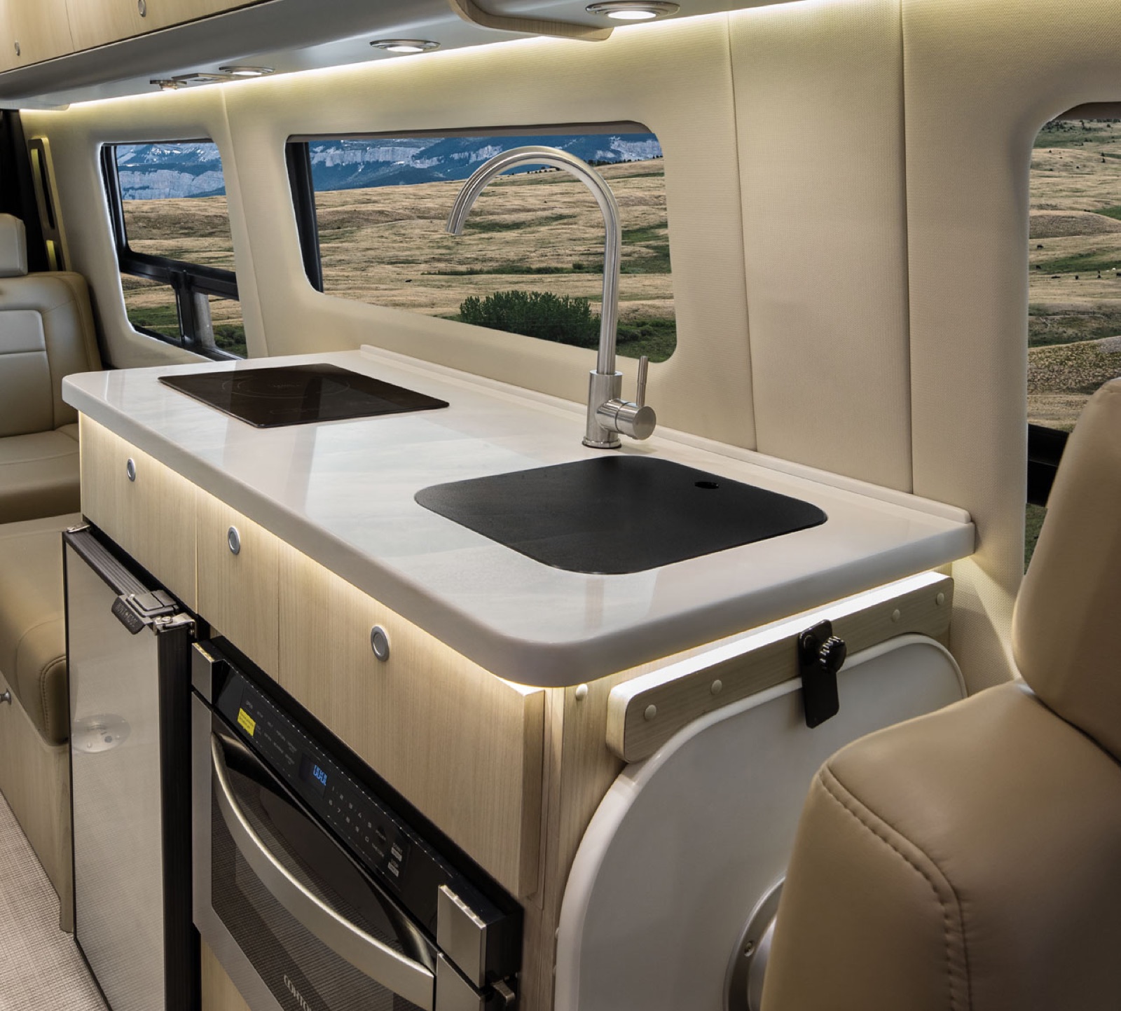 Onboard galley — induction cooktop, sink, fridge